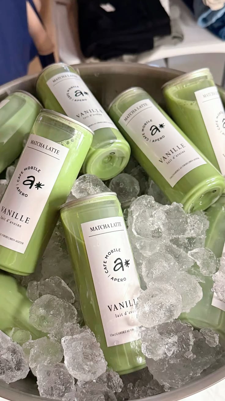 Matcha latte cans chilling in an ice bucket